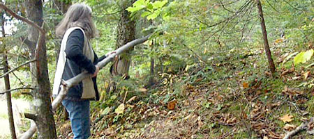 Peggi and Shelley carry big sticks home