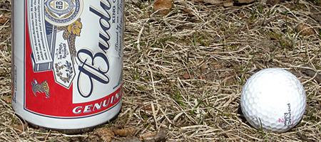 Budweiser can and golf ball