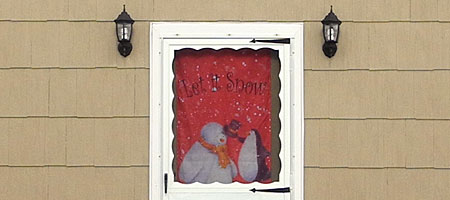 Beige house with Let It Snow banner in the window Rochester, New York Beige house with Let It Snow banner in the window Rochester, New York