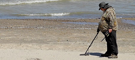 Metal detector dude on Durand Eastman beach in Rochester New York