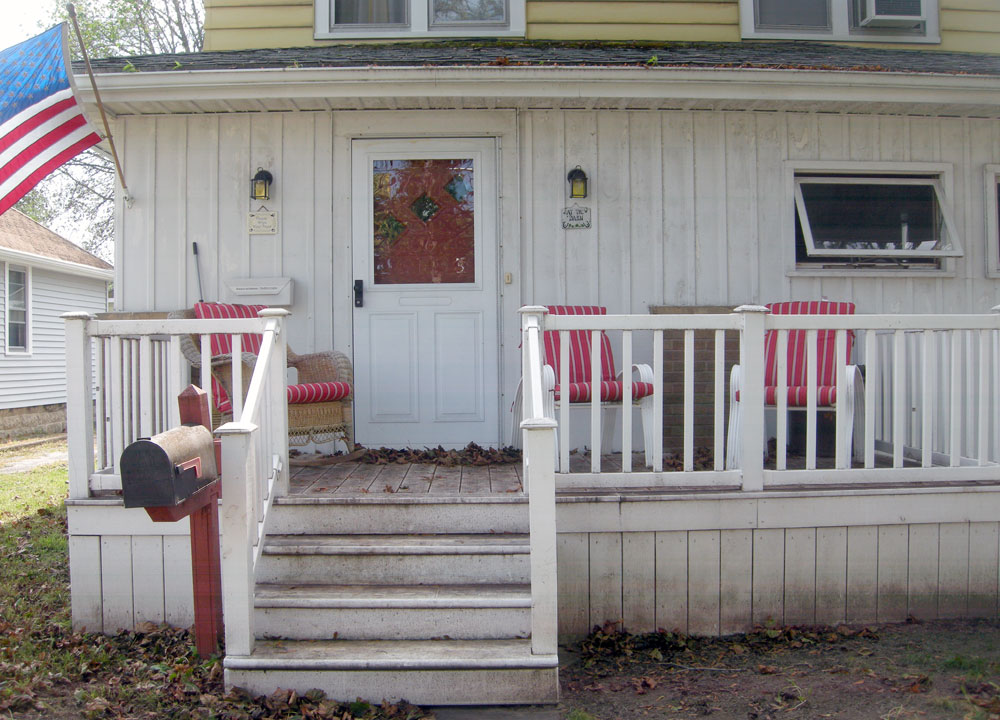 Porch with flag in Rochester, New York
