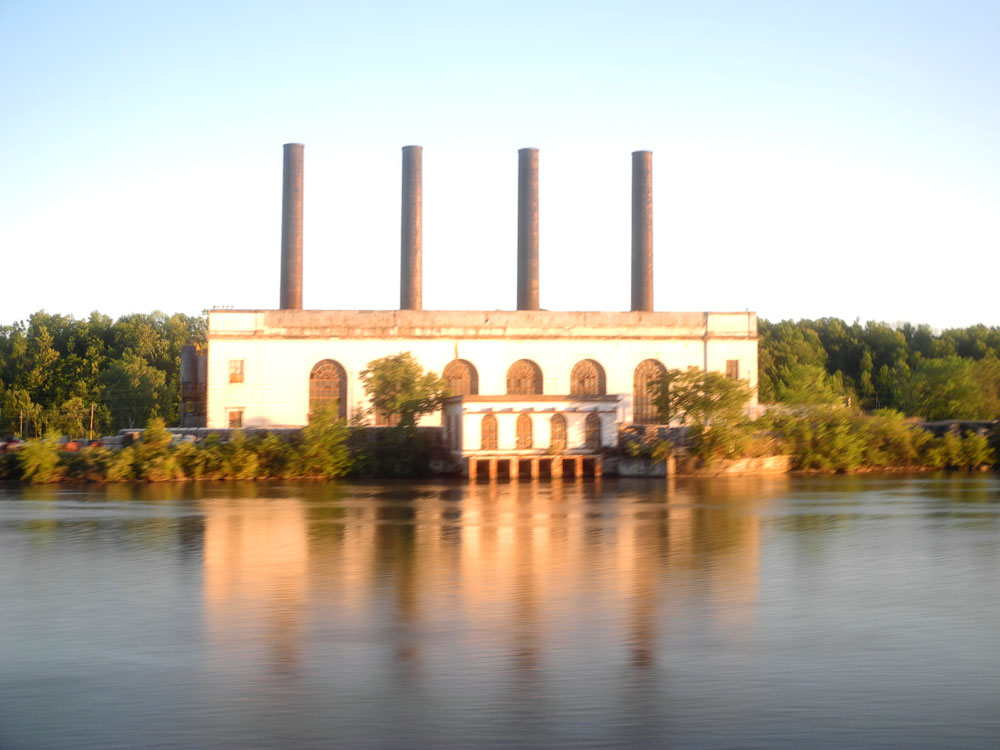 Building on Mohawk River shot from Amtrak train