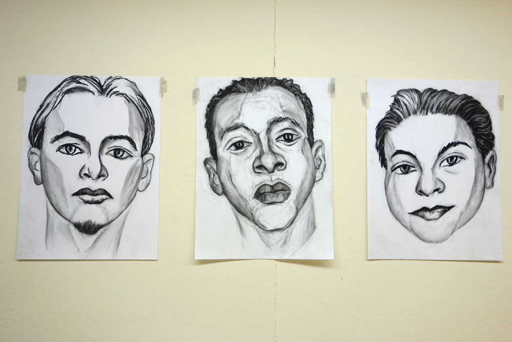 Three Paul Dodd drawings on wall at Creative Workshop in Rochester New York 2014