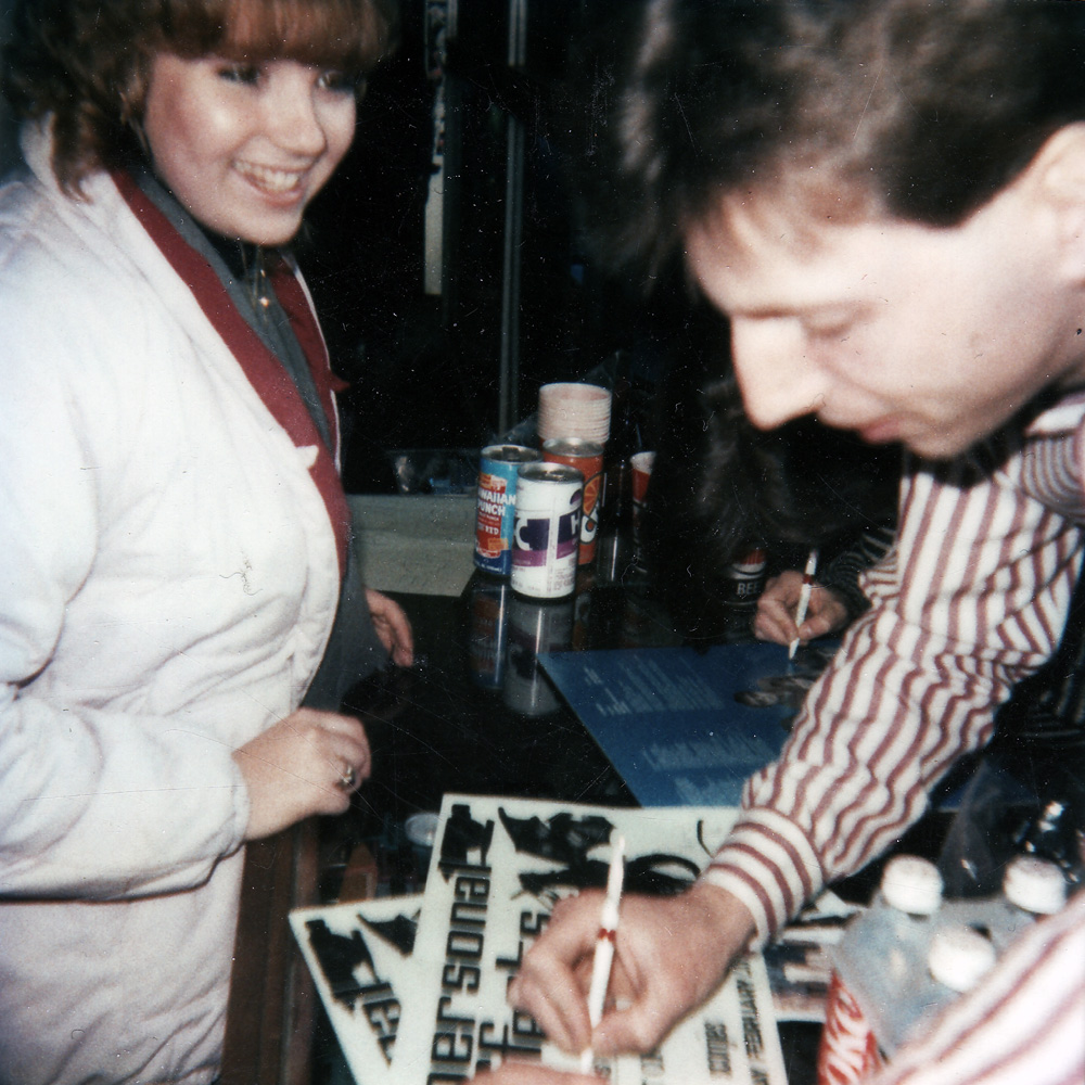 Bernie Heveron signing autograph for Sue Strawberry at House of Guitars in Rochester, New York.