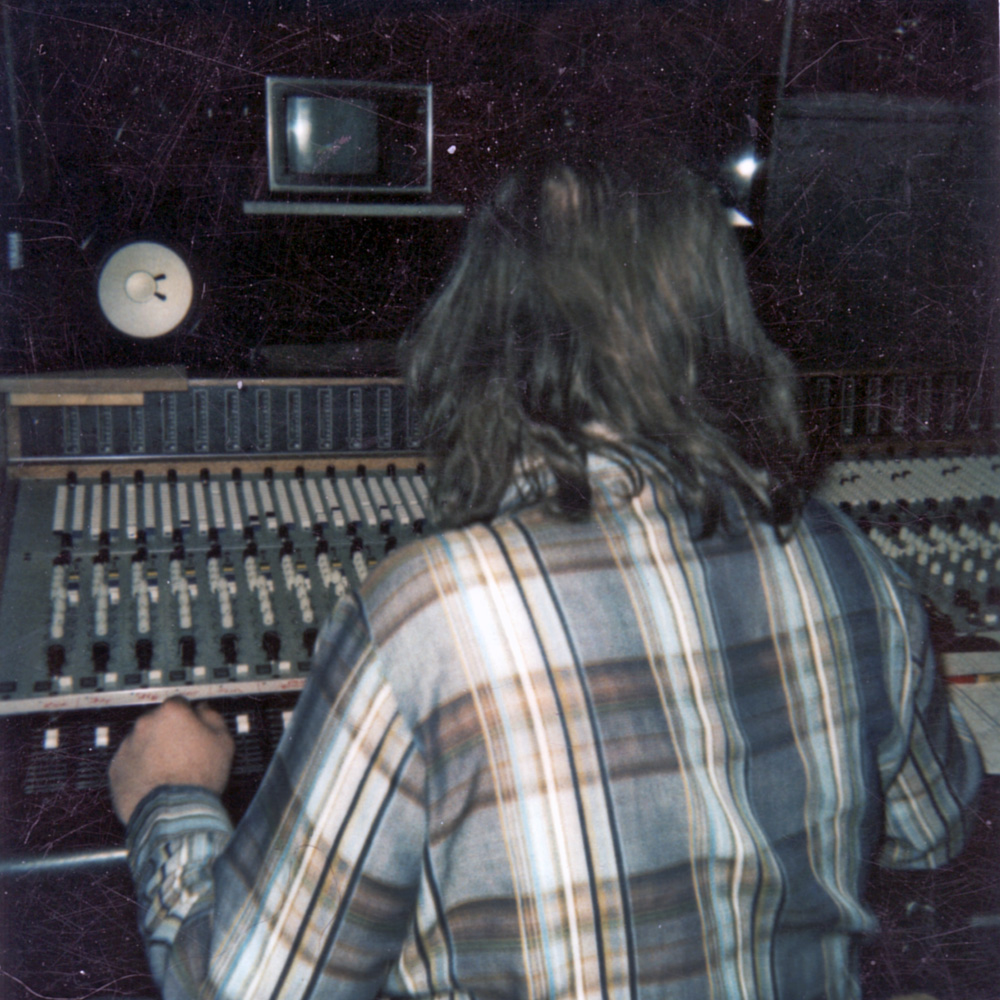 Dwight Marcus Glodell behind mixing board at PCI Studios.