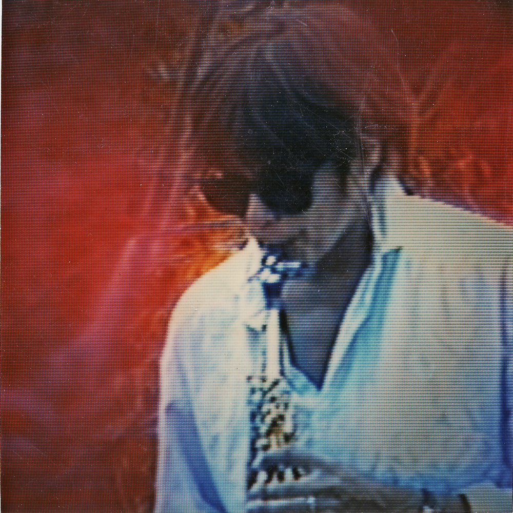 Peggi playing sax as seen on monitor, Duane Sherwood video.