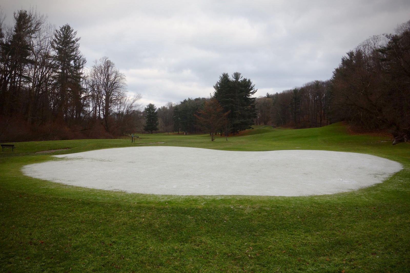 Snow covered green at Durand Eastman GolfCourse