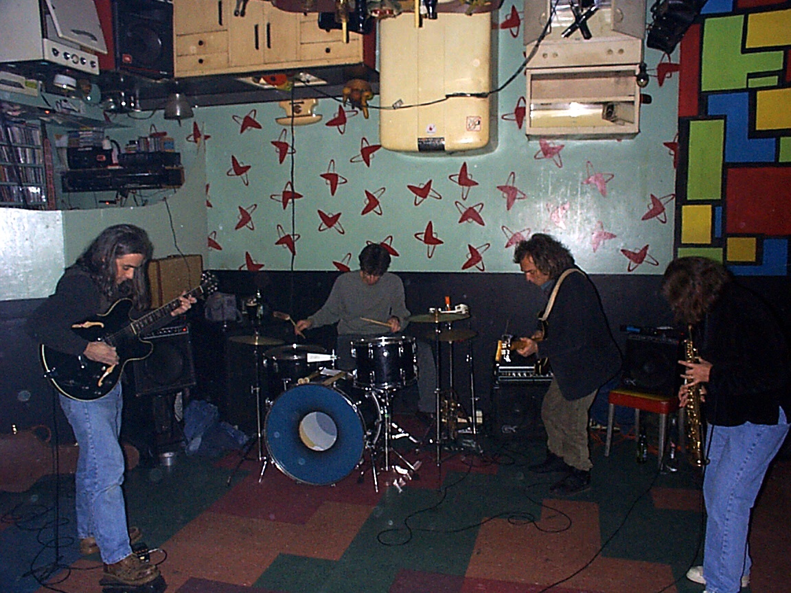 Margaret Explosion playing at Bug Jar Happy Hour in 1998. Jack Schaefer on guitar, Paul Dodd on drums. Pete LaBonne on bas guitar and Peggi Fournier on soprano sax.