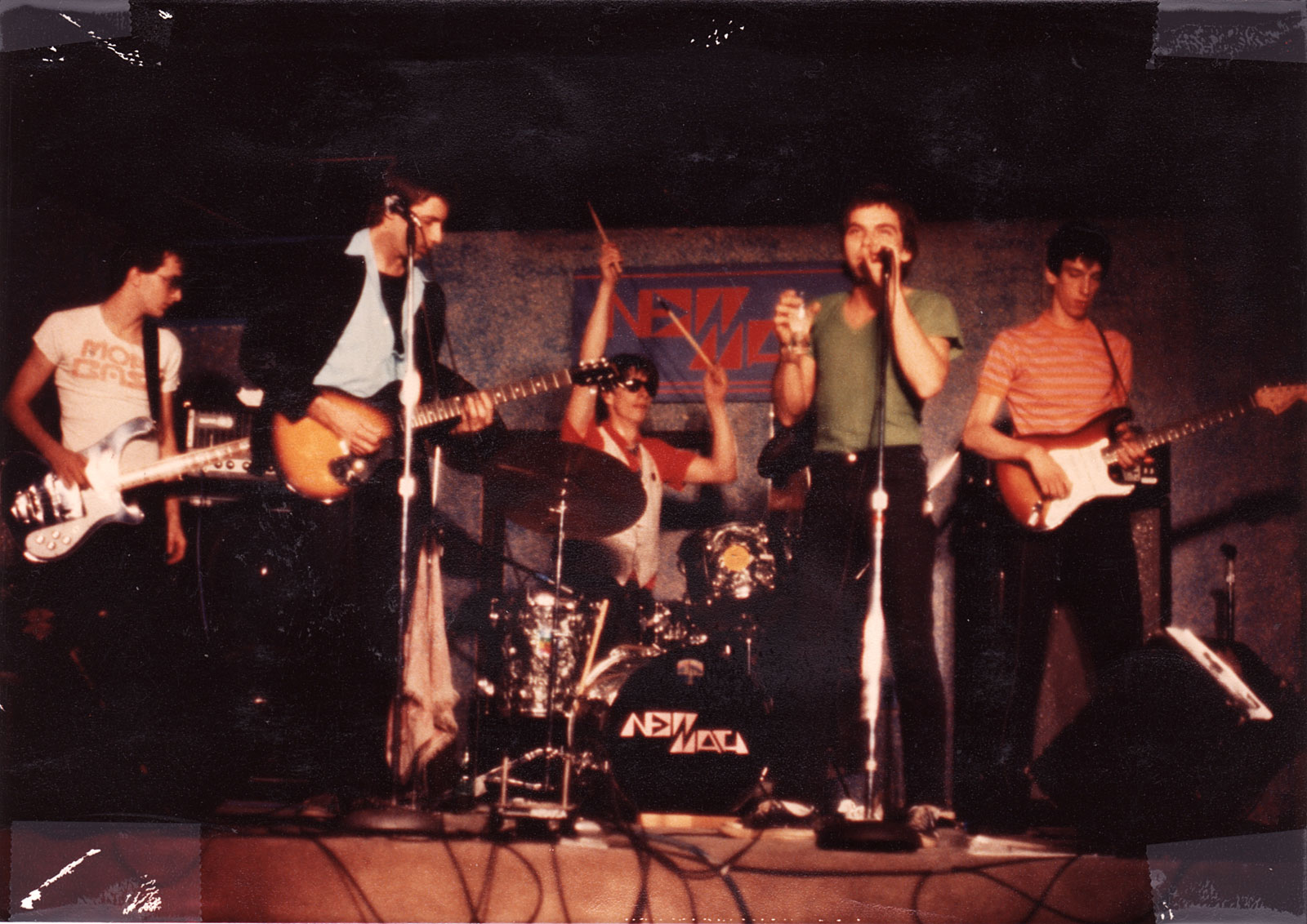 New Math performing at the Orange Monkey in 1977. Robert Slide - bass, Gary Trainer - guitar, Paul Dodd - drums, Kevin Patrick - vocals, Dale Mincey - guitar