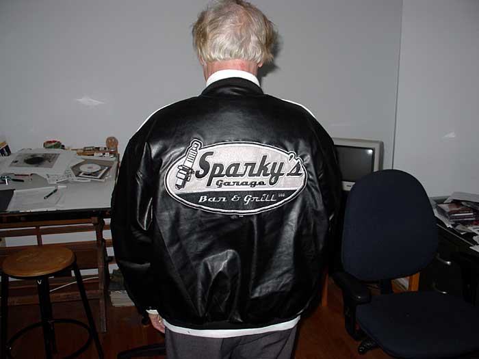 Sparky stops by our new place with his Sparky jacket.