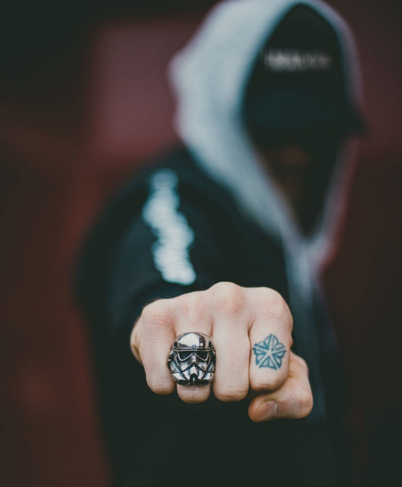 Chris with skull ring and Roc logo
