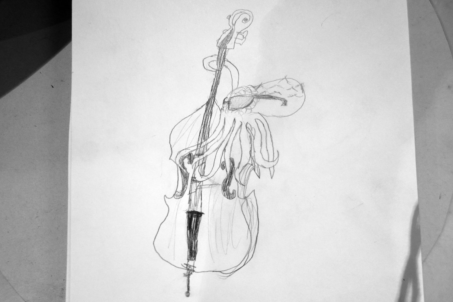 Oscar's drawing of Ken Frank as an octopus playing bass.