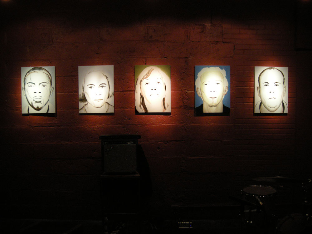 Paul Dodd Crime Faces on the front wall of the Little Theater Cafe