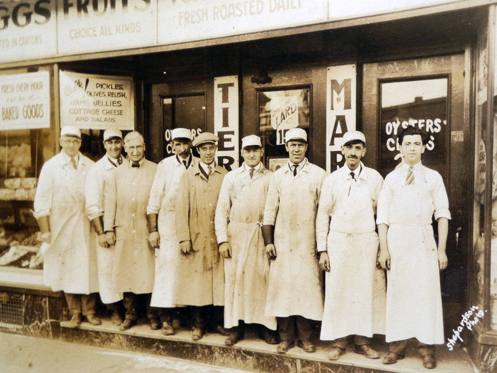 Ray Tierney Senior, far left, in front of his store on North Street in Rochester, NY