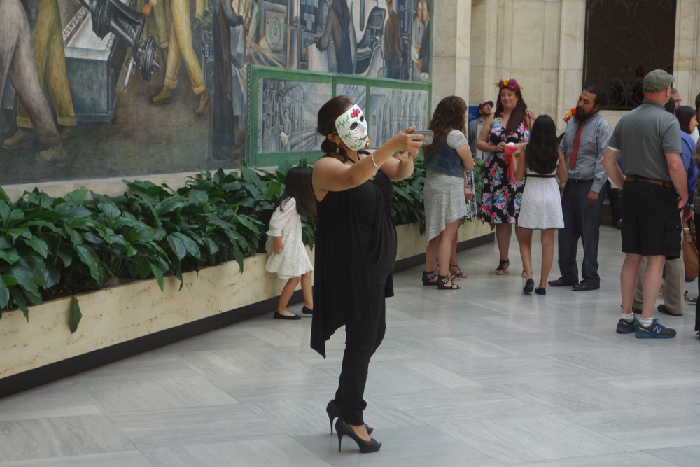 Woman in Mexican mask at Detroit Institute of the Arts