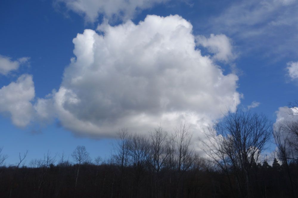 Big white cloud over Hoffman Road in Rochester, New York