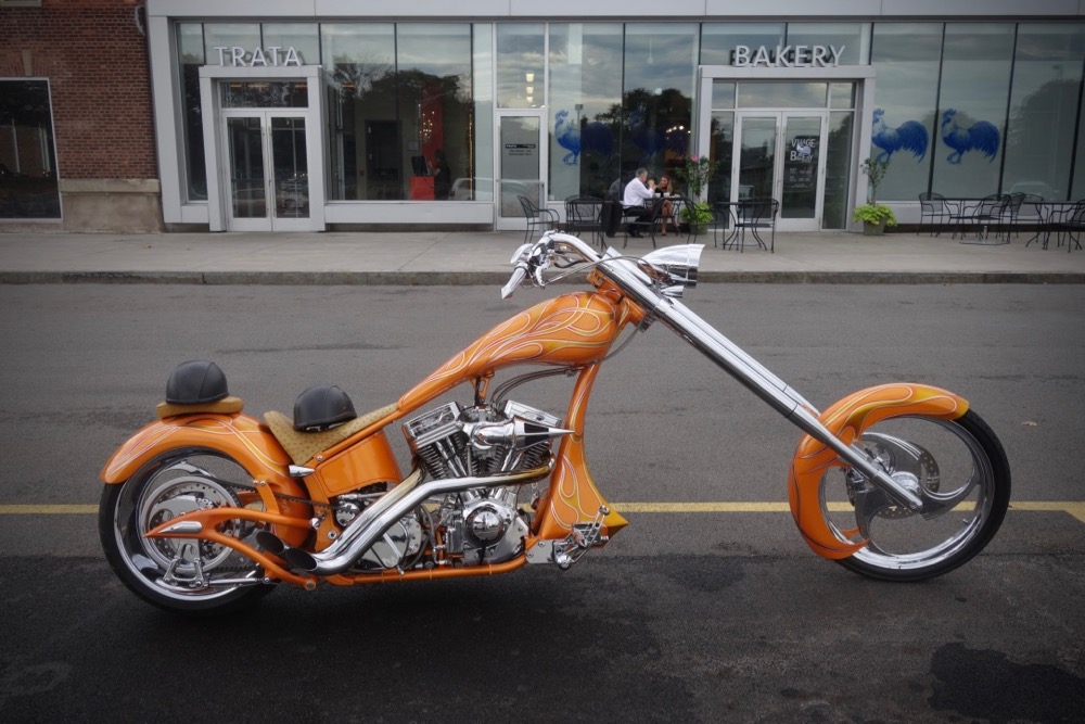 Orange motorcycle in front of Trata Restaurant in Rochester New York