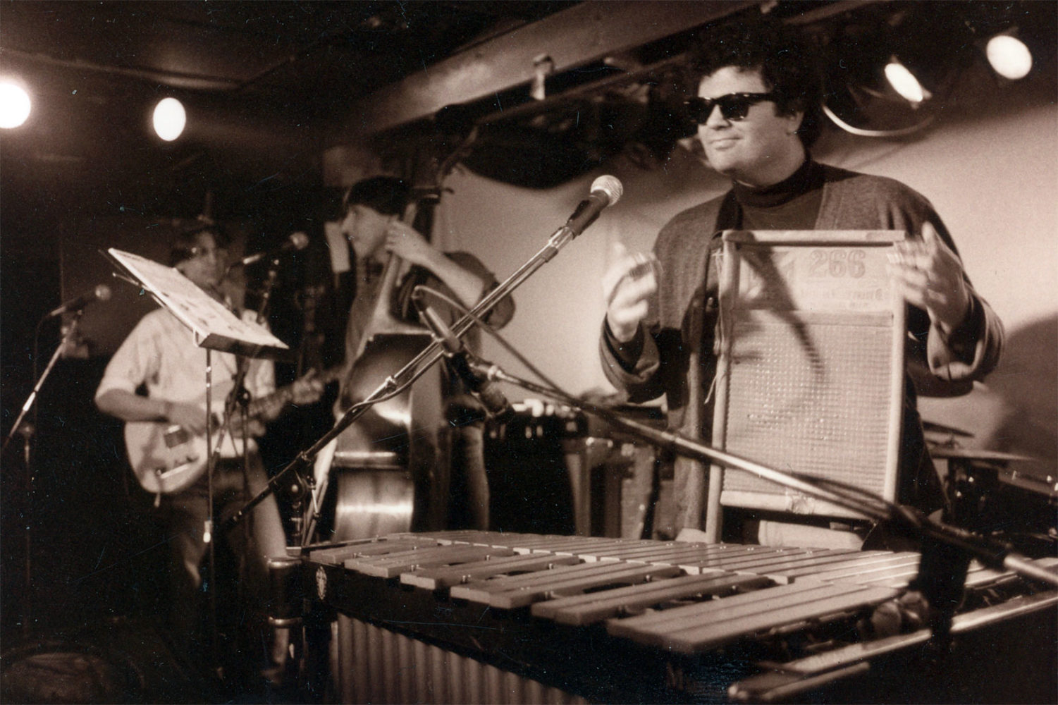 Chuck Cuminale playing washboard at Scorgies with The Colorblind James Experience. Photo by Gary Brandt.