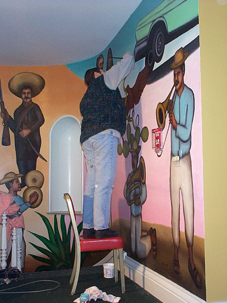 Peggi Fournier working on Mex Restaurant Mural by Paul Dodd, in progress, 1999.
