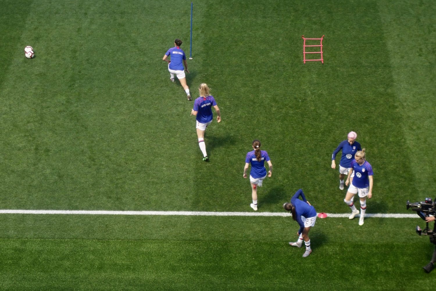 USA team in warm-ups at Red Bull Stadium, the last match before the 2019 World Cup. Rose Laverre is shown with red USA tape on her hamstring.