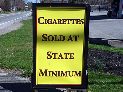 Cigarettes at State Minimum sign