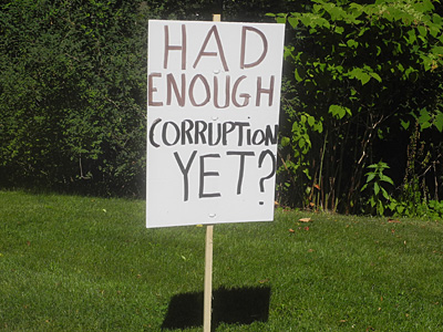 Enough Corruption sign