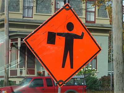 Man with flag sign