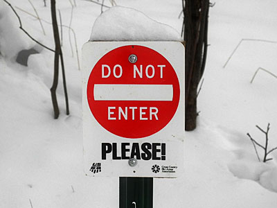 a sign like this in front of your house and it actually reads, “Don’t even think about stepping foot on our property. We’re armed to the teeth.”