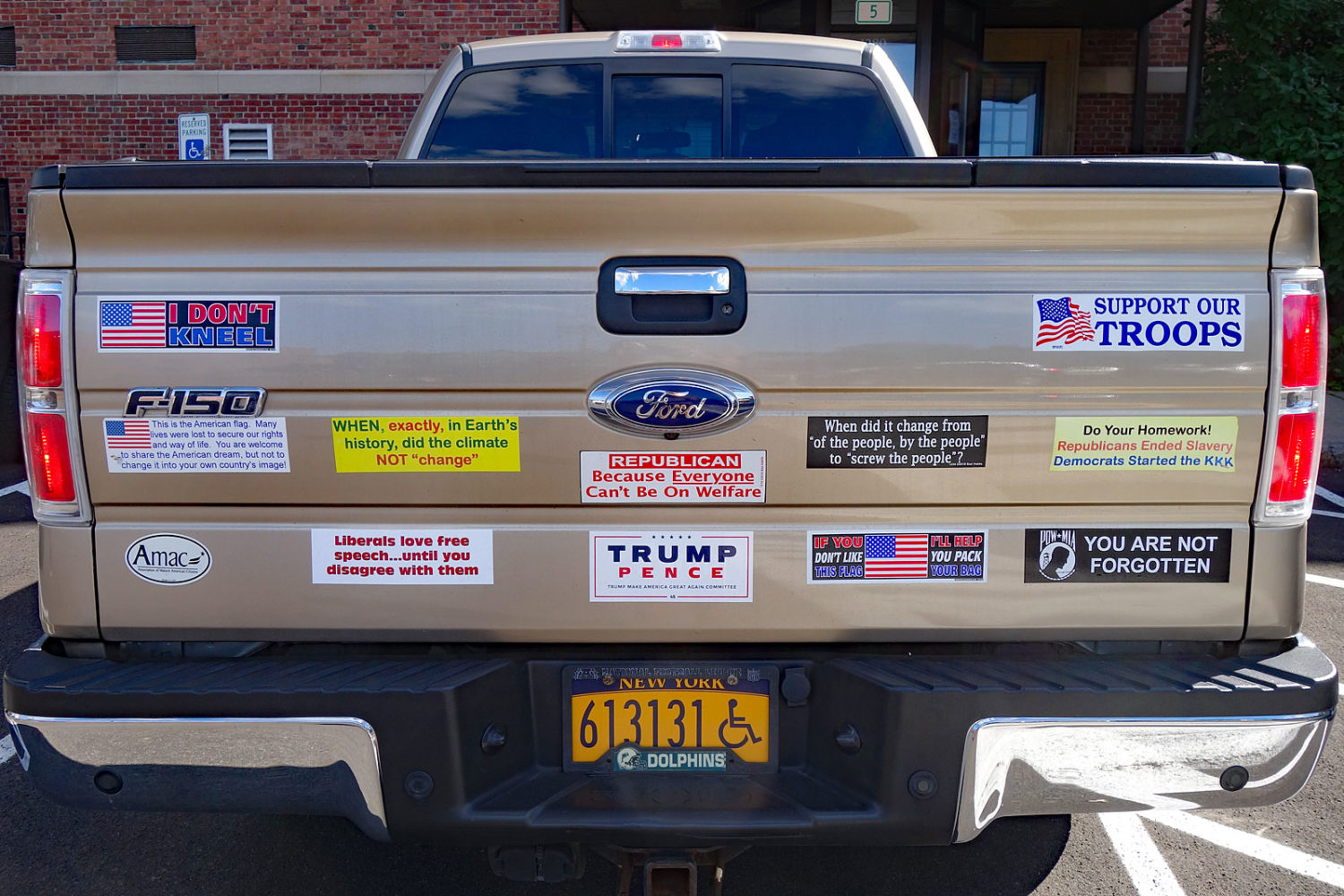 Big ass truck with obnoxious bumper stickers at Town Hall