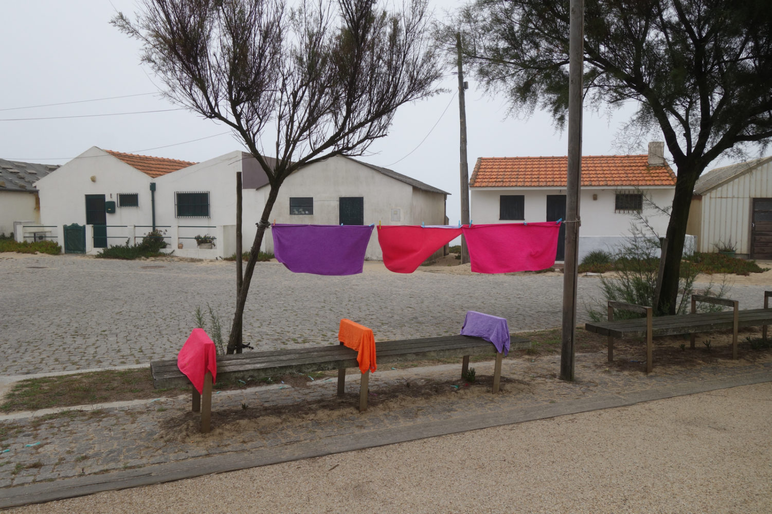 Clothes on the line in small town on coast of Portugal.