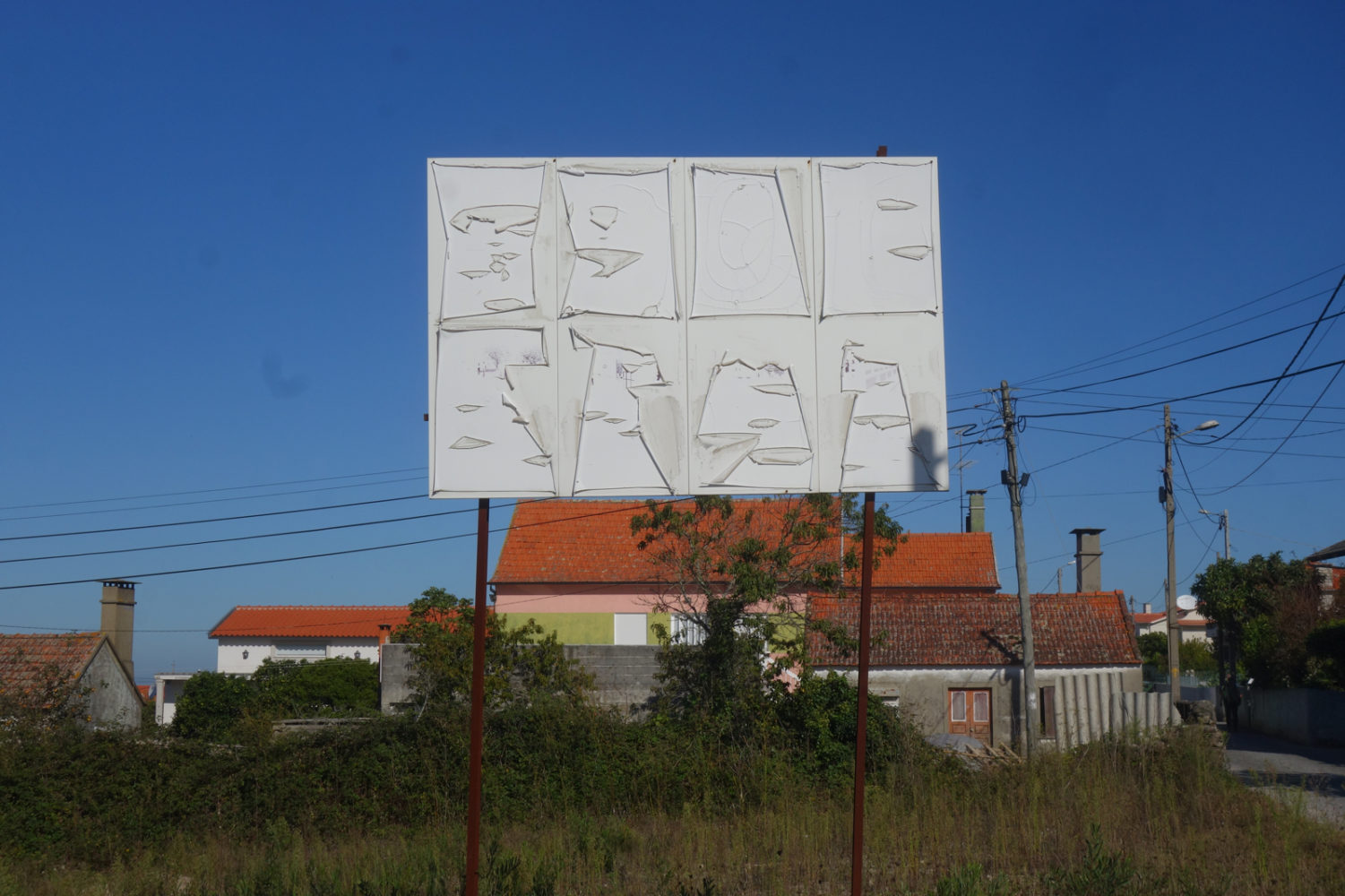 Sign saying something along coast in Portugal