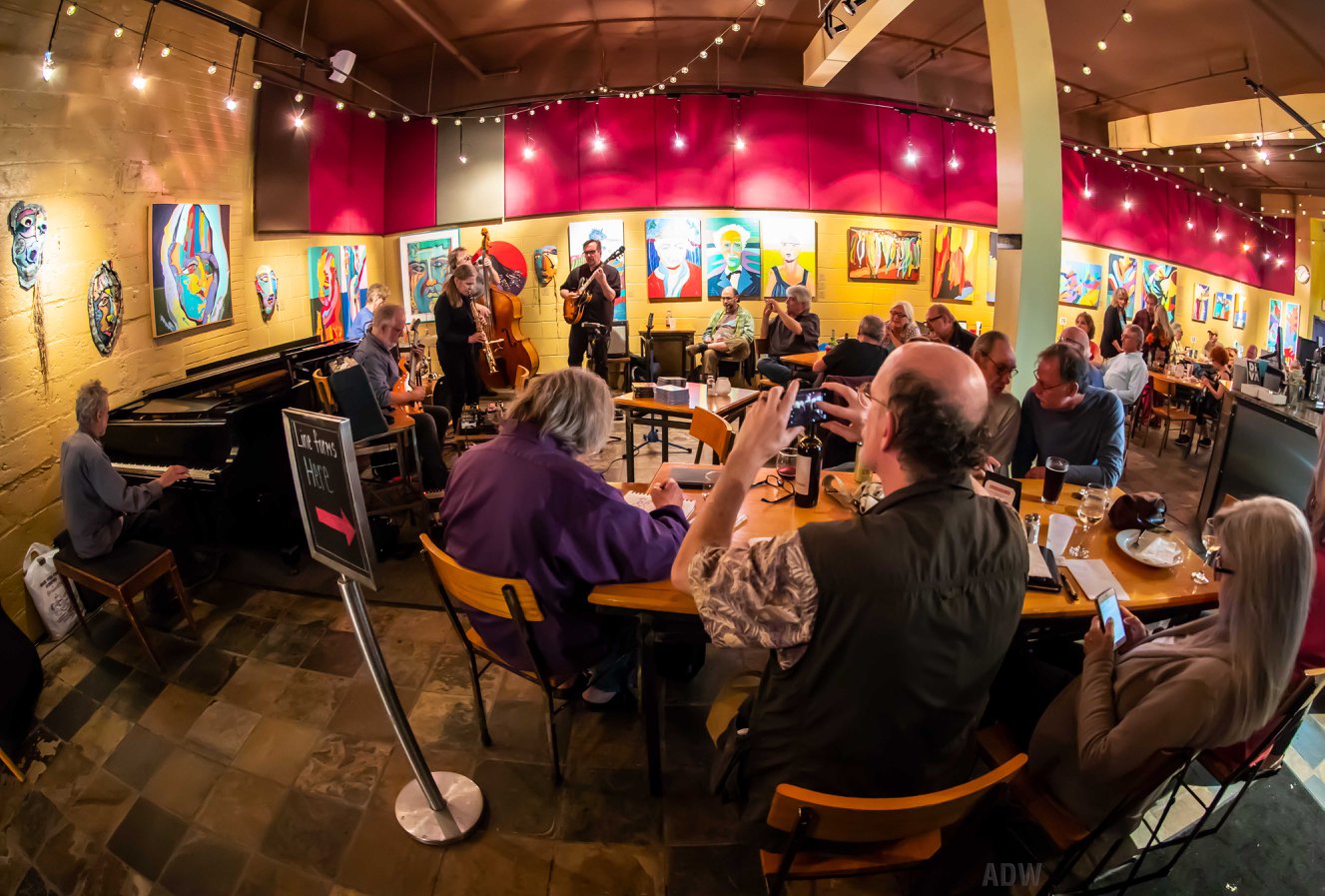 Margaret Explosion fish eye photo by Aaron Winters. Pete LaBonne on piano, Bob Martin on guitar, Peggi Fournier on saxophone, Ken Frank on bass and Phil Marshall on guitar.