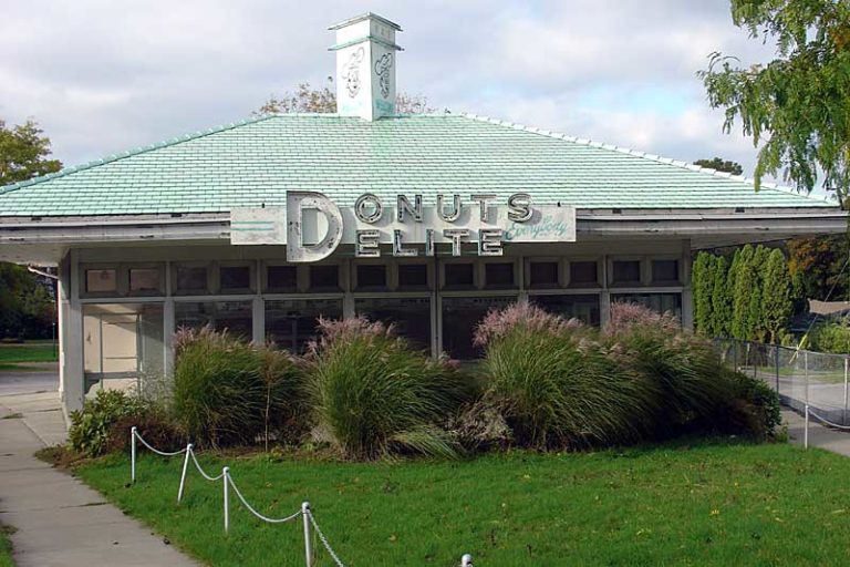 Donuts Delite was turquoise and pink before it faded away. They spelled both doughnuts and delight wrong. Their plain fried cakes and coffee were extraordinary. It was too perfect to last. Culver Road in Rochester, New York.