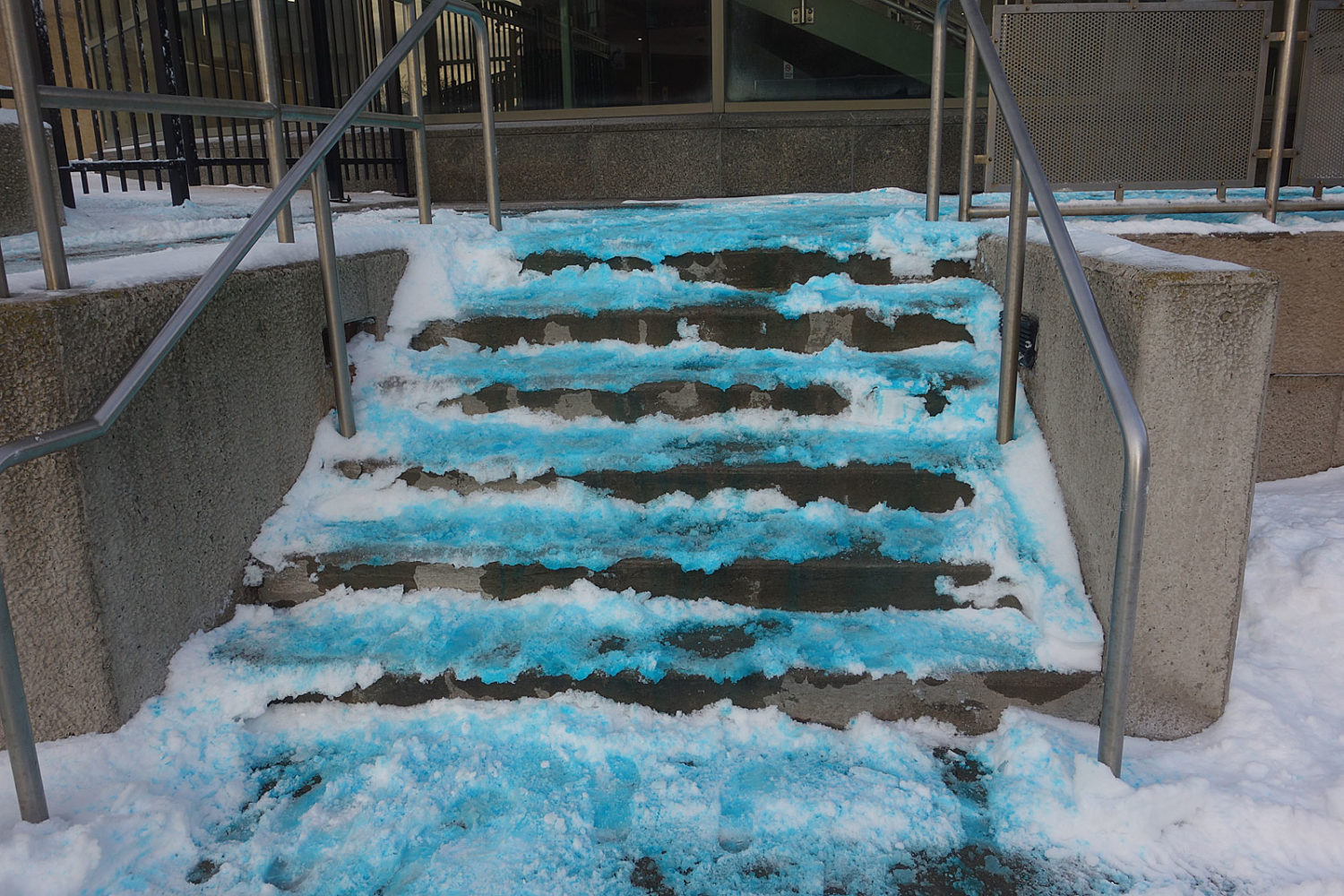 Blue snow on steps in front of Monroe County Court House, downtown Rochester, New York