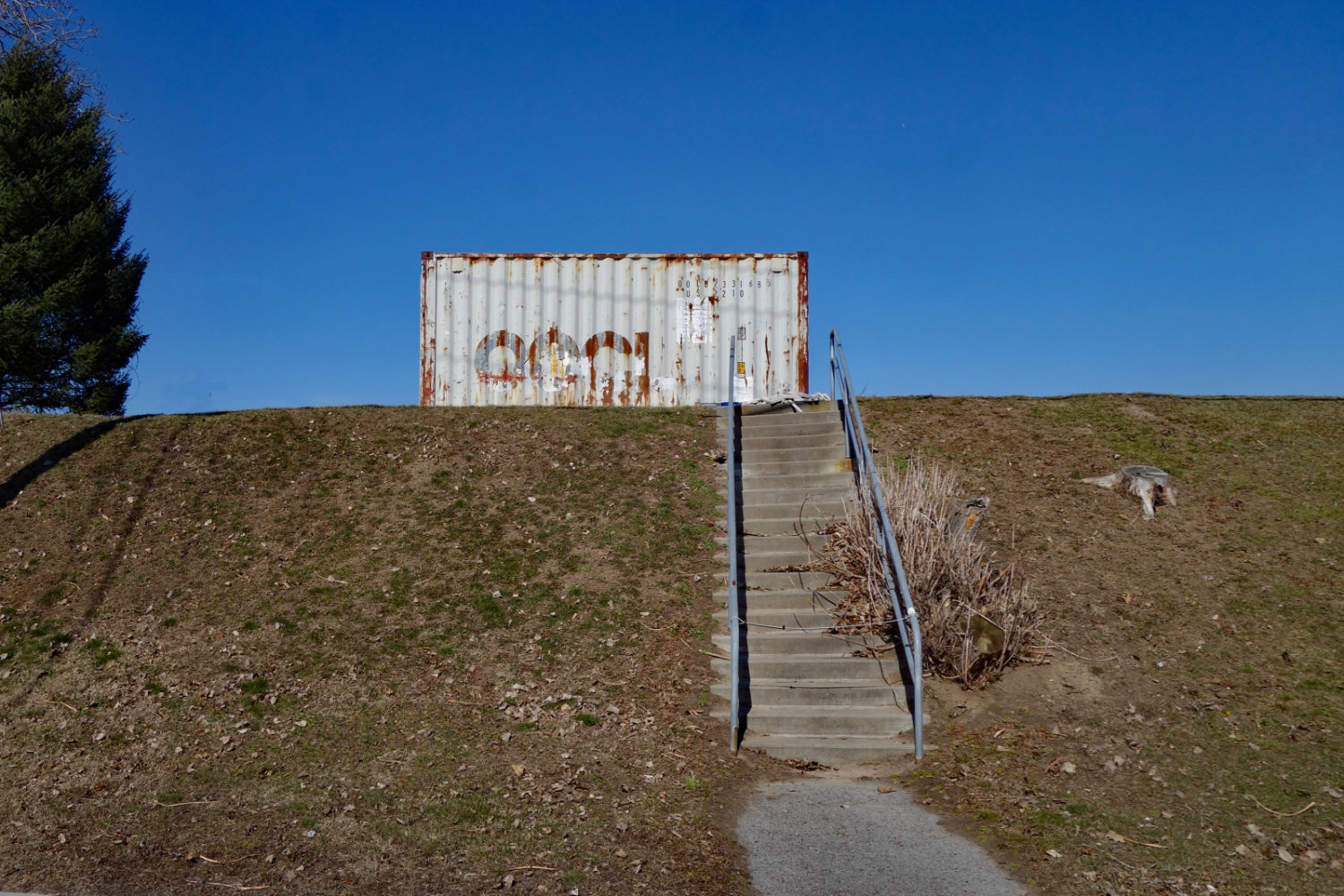 Shipping container along lake shore. Sea Breeze, New York