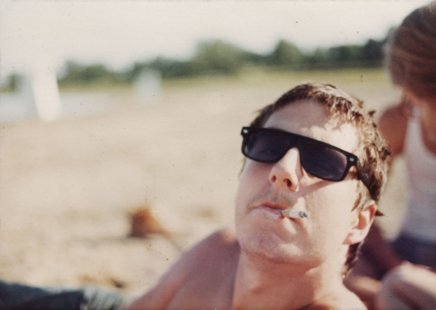 Steve Hoy smoking a cigarette at Lake Monroe