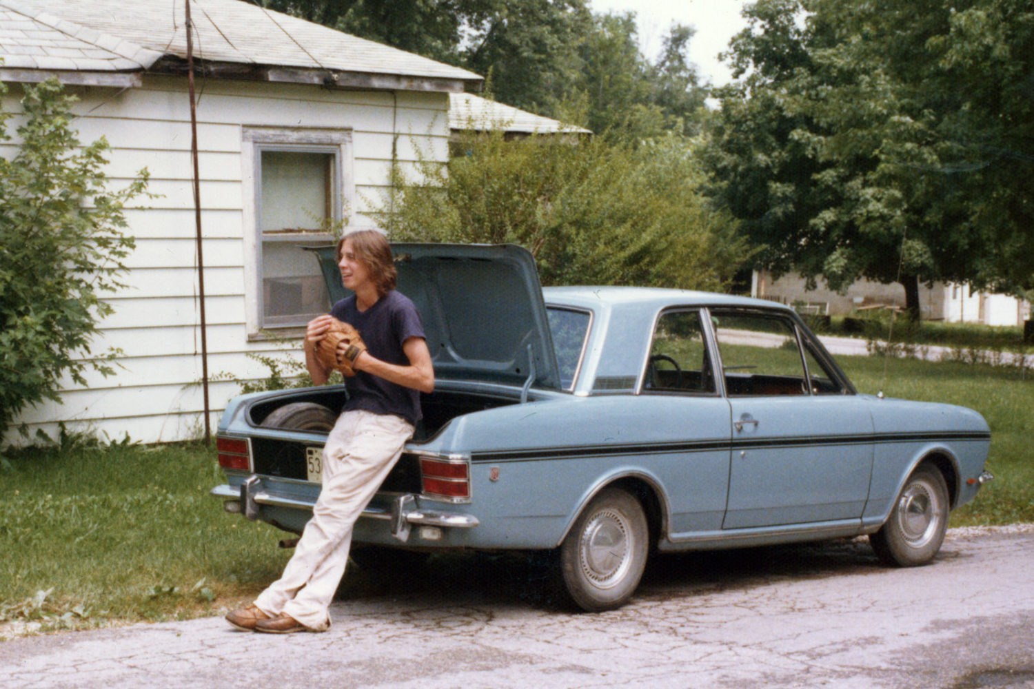 Fran with Steve's English Ford in front of Milton house