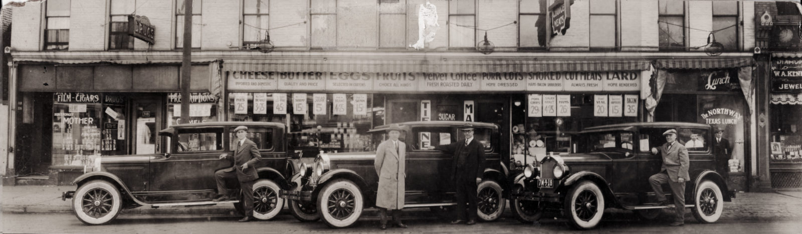 Art Tierney, Ray Tierney and Joe Tierney in front of Tierney Market, 312 North Street in Rochester New York, with their three brand new Buicks. 1926