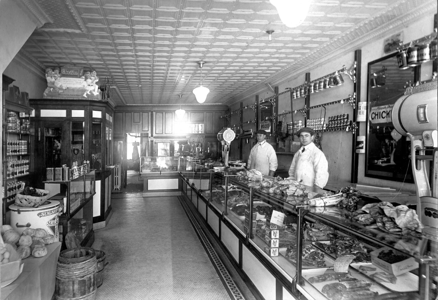 Ray Tierney, on left,  inside Tierney Market 312 North Street Rochester circa 1920