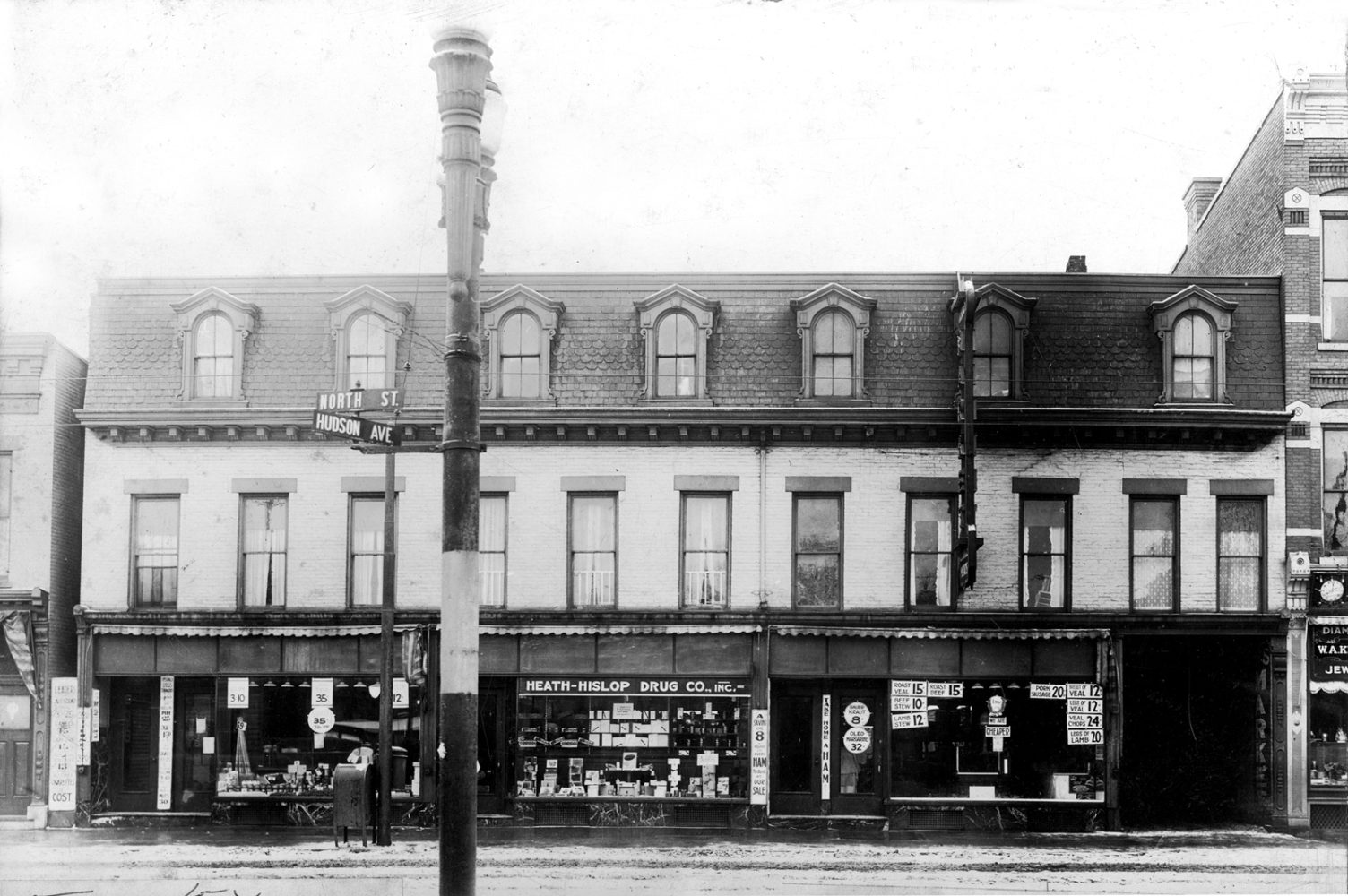 Tierney Market at the intersection of Hudson Avenue and North Street in Rochester, New York. Tierney Market is pictured on the right of this building and the Tierney Annex is on the left. 1916