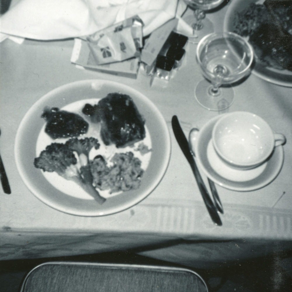 Kodak Instamatic film and dinner on table