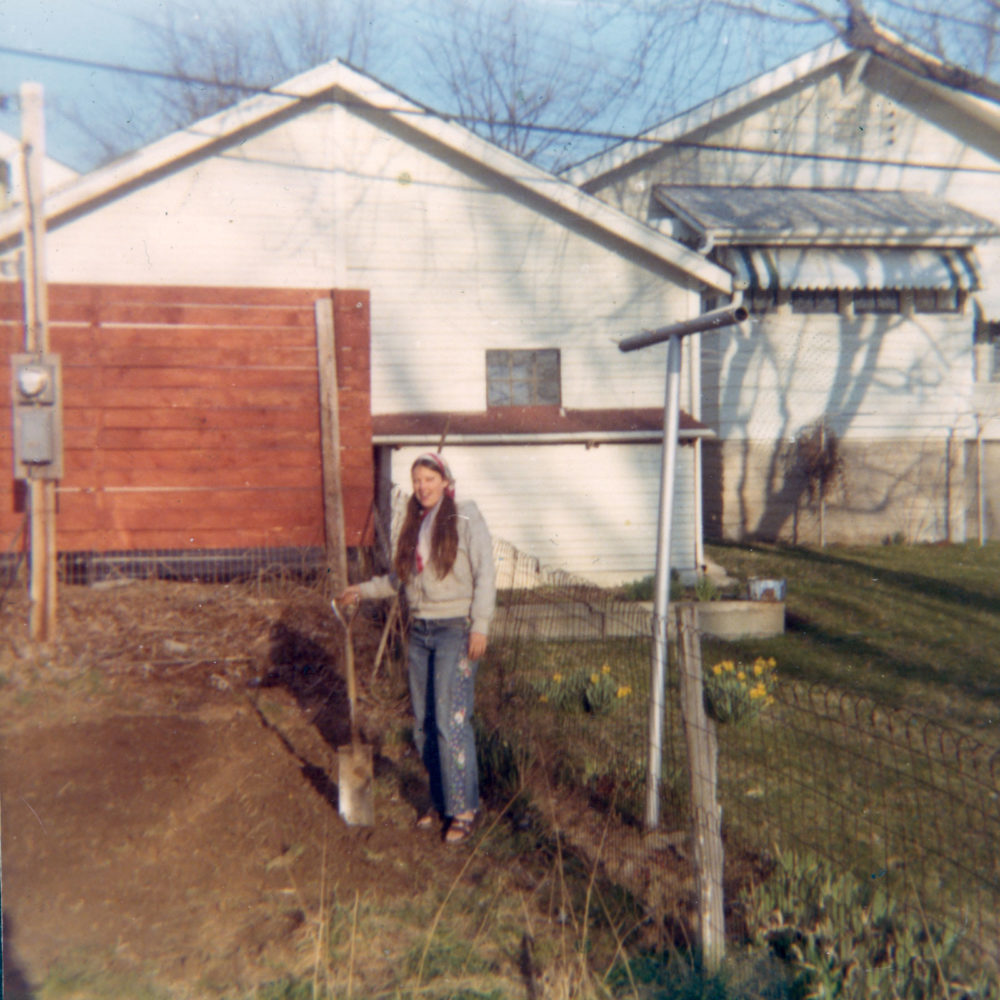 Pam in the garden at the trailer