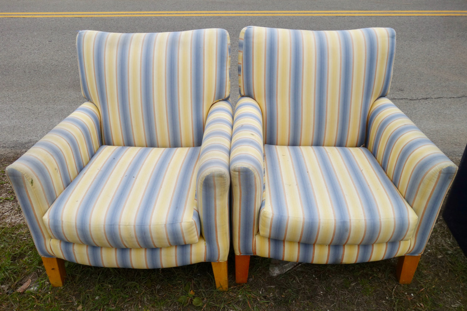 Two Blue striped chairs at the curb in Rochester, New York