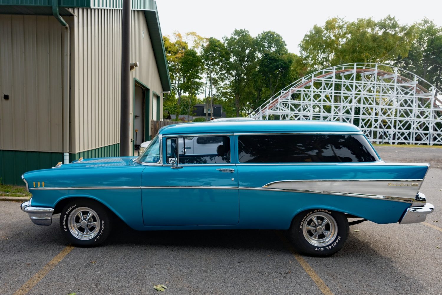 Turquoise Chevy station wagon parked at Sea Breeze Amusement Park