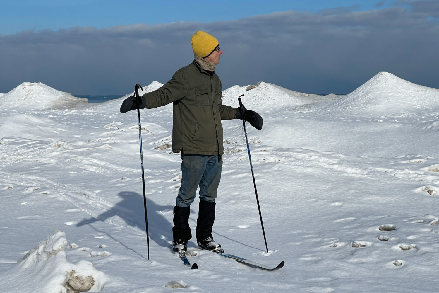 Paul on beach with ice formations. Photo by Peggi Fournier.