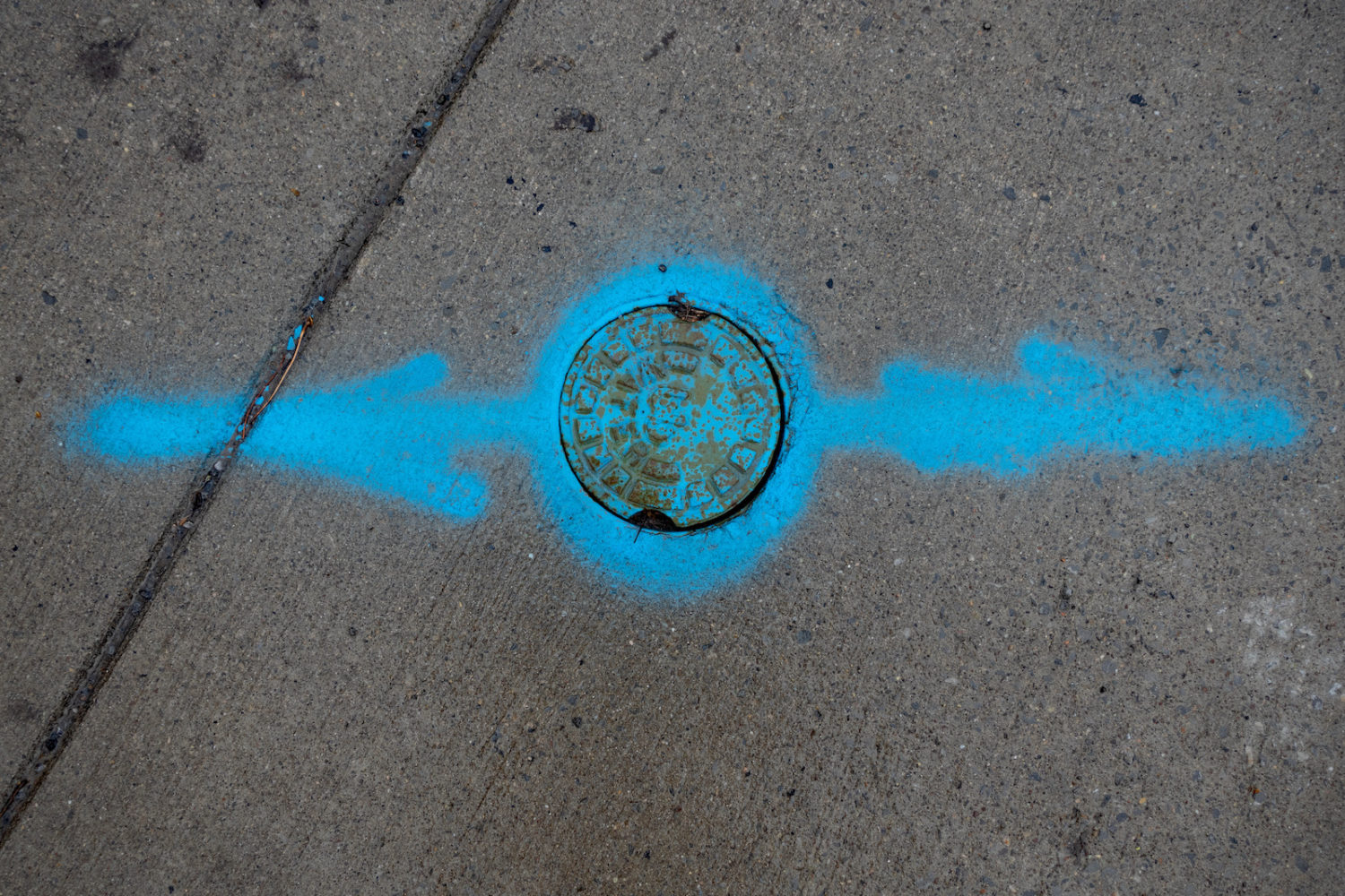 Utility company artwork on sidewalk