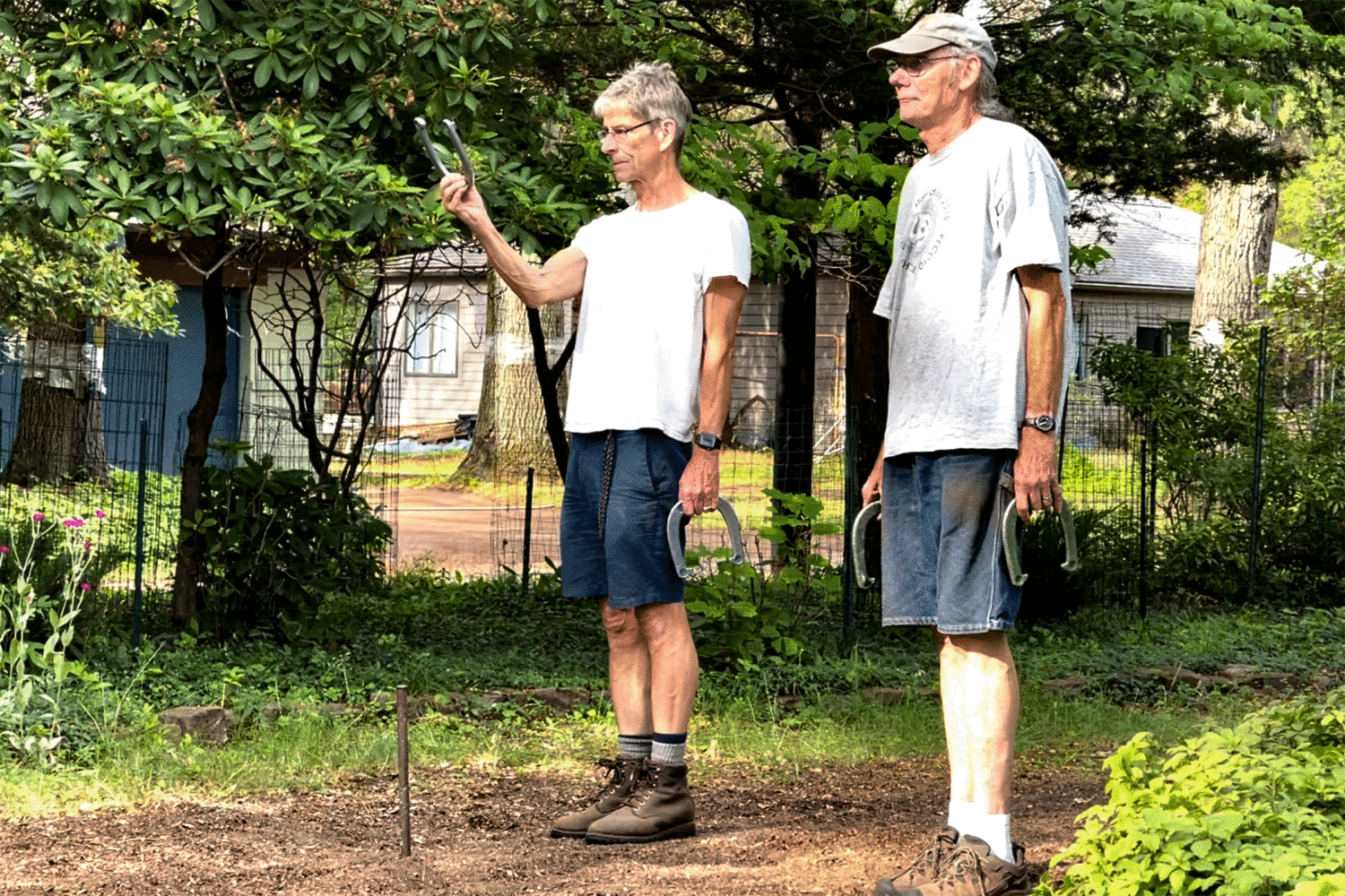 Paul and Rick playing horseshoes in the front yard - photo by Peggi Fournier
