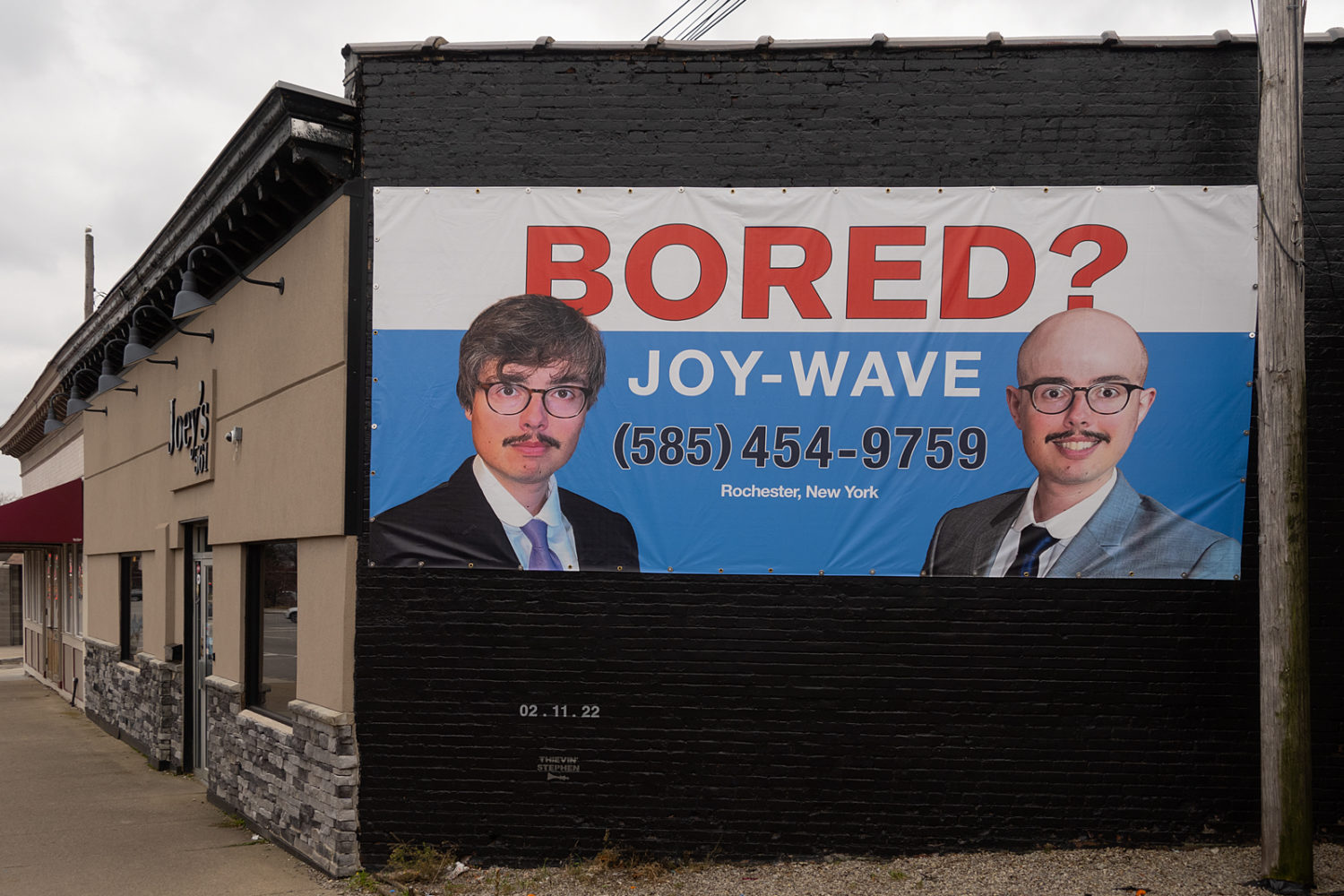Joy Wave Cellino & Barnes billboard on side of Joey's in downtown Rochester, NYJoeys
