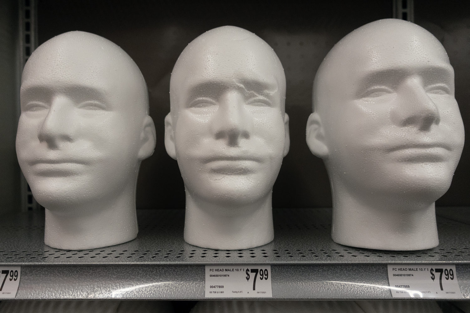 Styrofoam male heads on shelf at Michaels