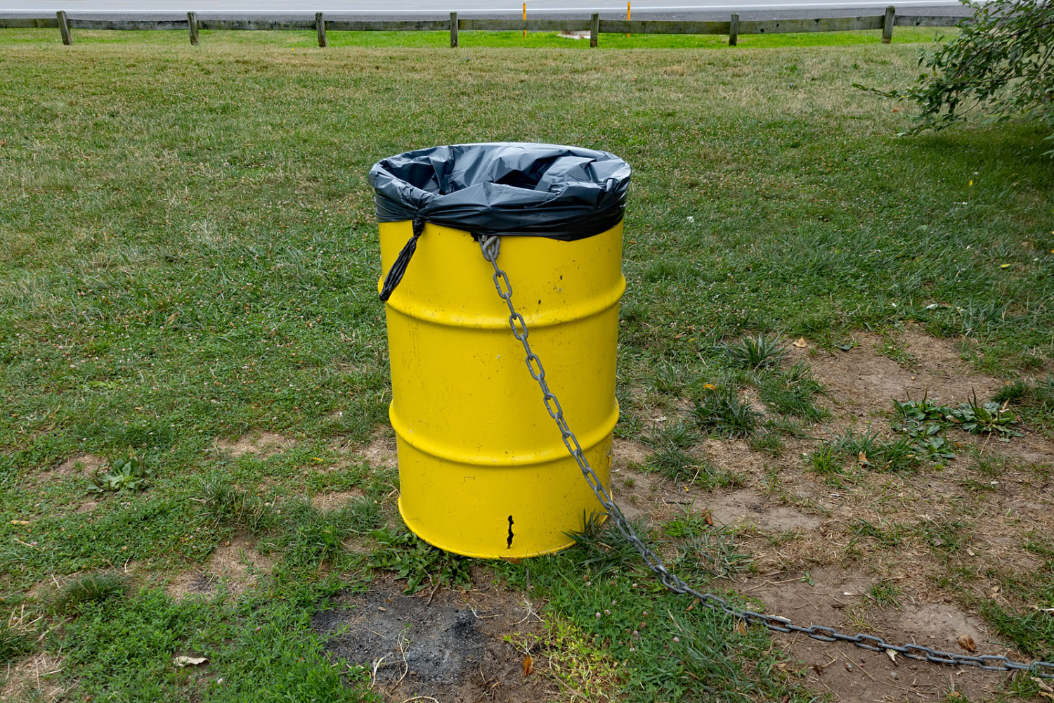 Yellow trash can along beach